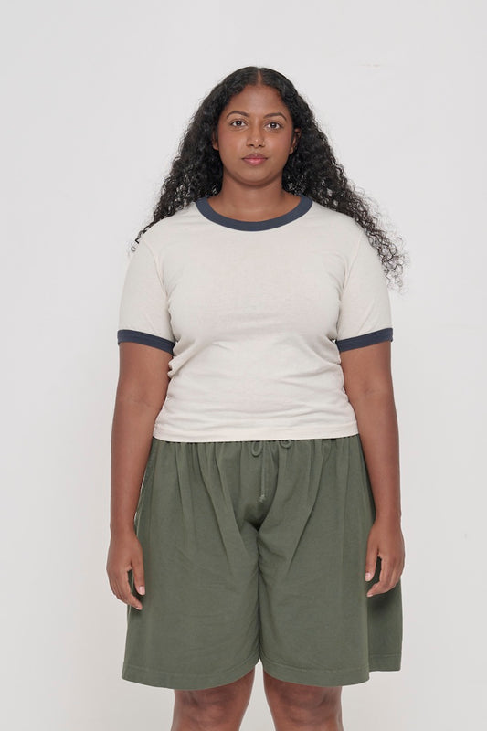 A 5'8" woman wearing a Ringer Trash Tee in Slate. Hem hits her upper-middle hip.