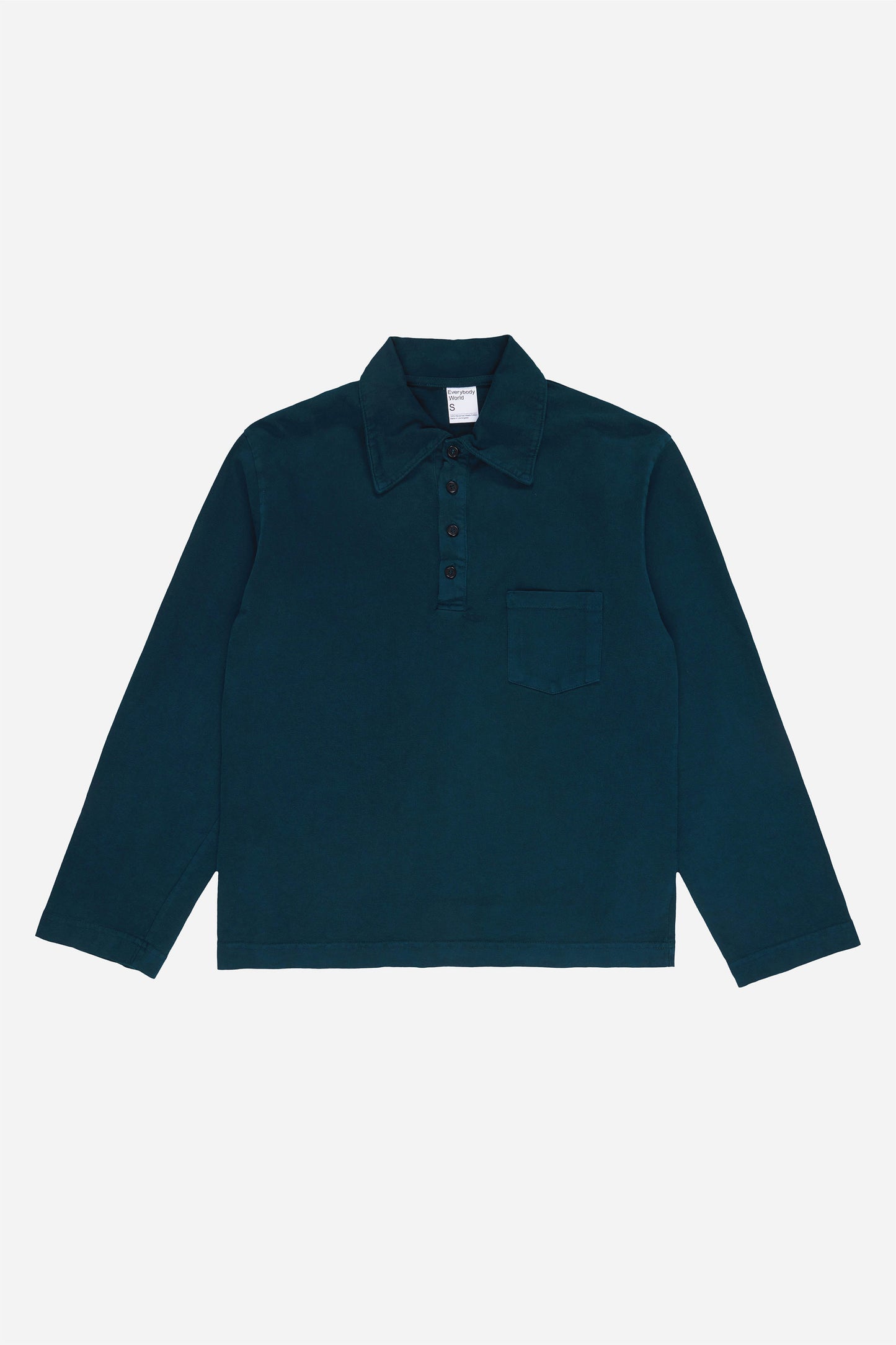 Flat lay of the Juniper Rugby Trash Polo, showing color, buttons, and front pocket.