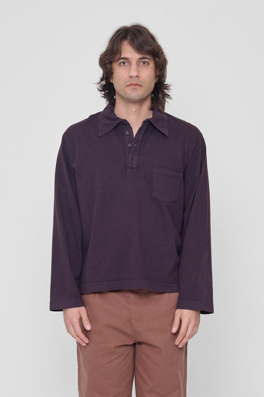 6'2" model in size L Mulberry Rugby Trash Polo. Bottom hem his upper hip.