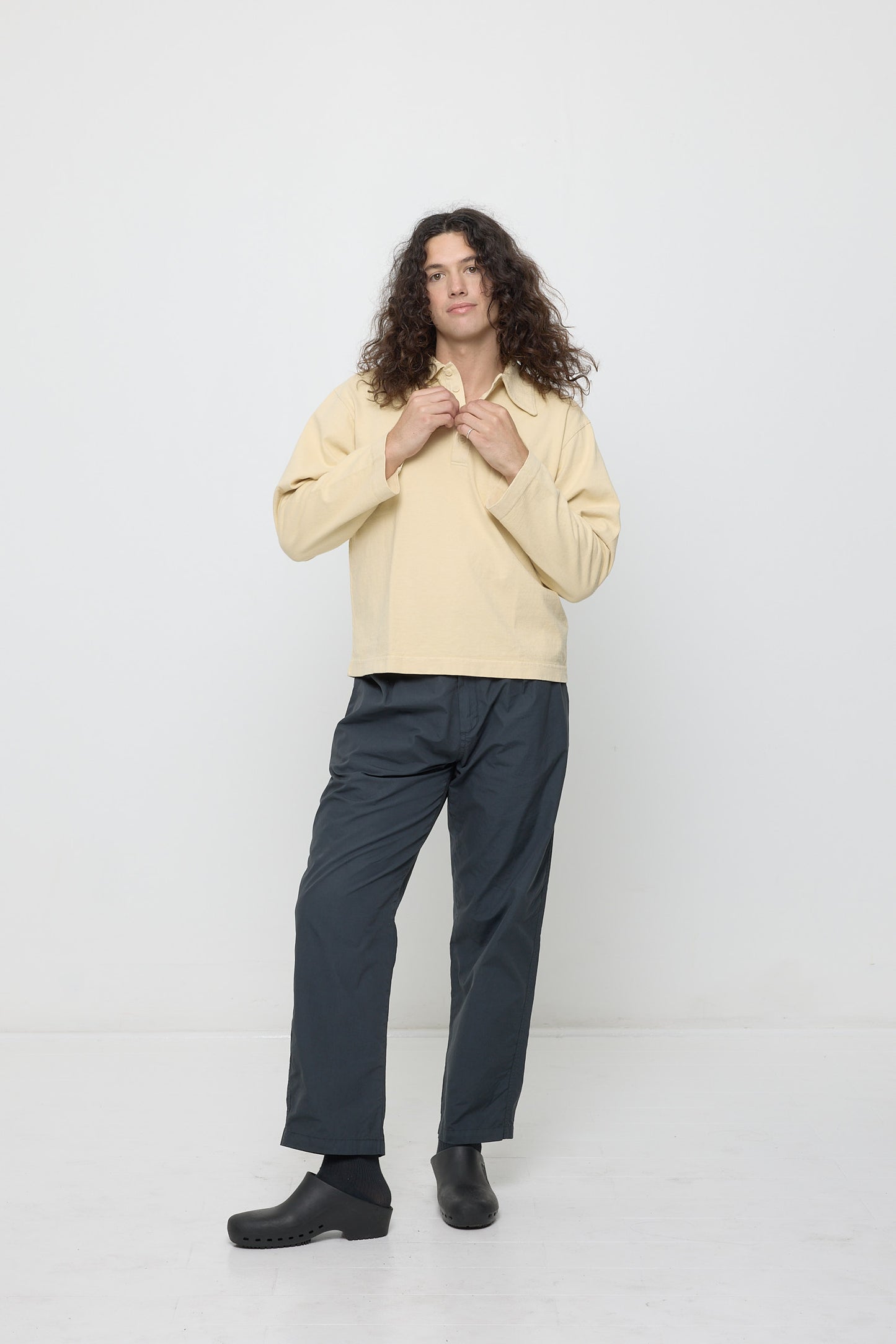 Person wearing Turtle Dove Rugby Trash Polo with Life Uniform Pants.