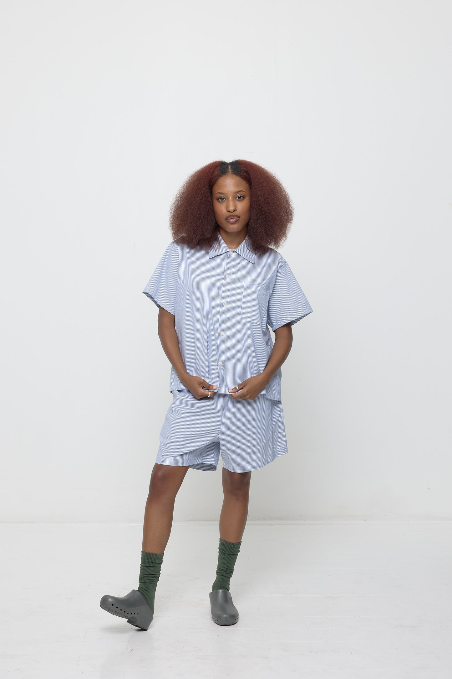 Woman wearing buttoned up blue Short Sleeve Stripe Poplin Button Up Shirt with matching Everyday Shorts