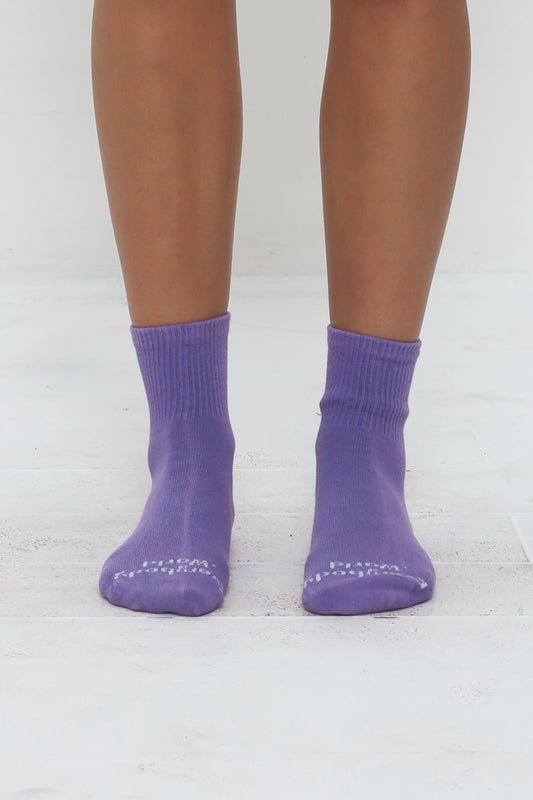 Carpe Diem Spring Socks, branded 'Everybody.World' in white, ankle-high, shown on lower legs.