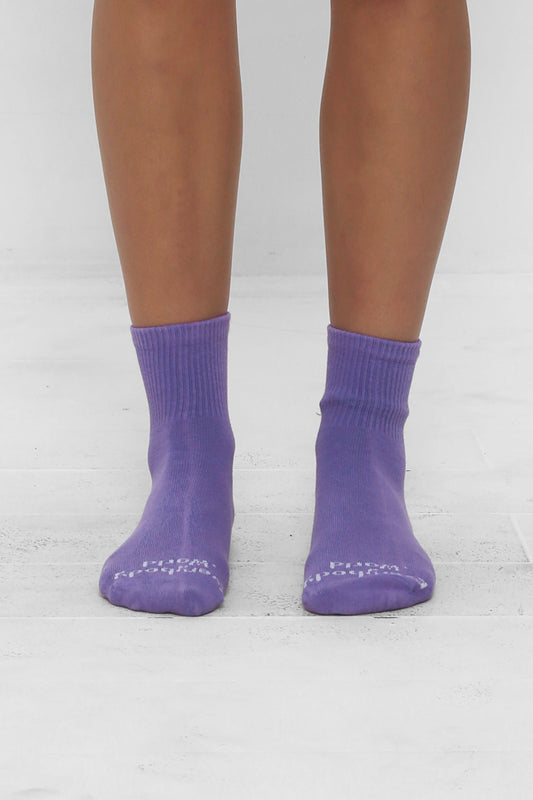 Carpe Diem Spring Socks, branded 'Everybody.World' in white, ankle-high, shown on lower legs.