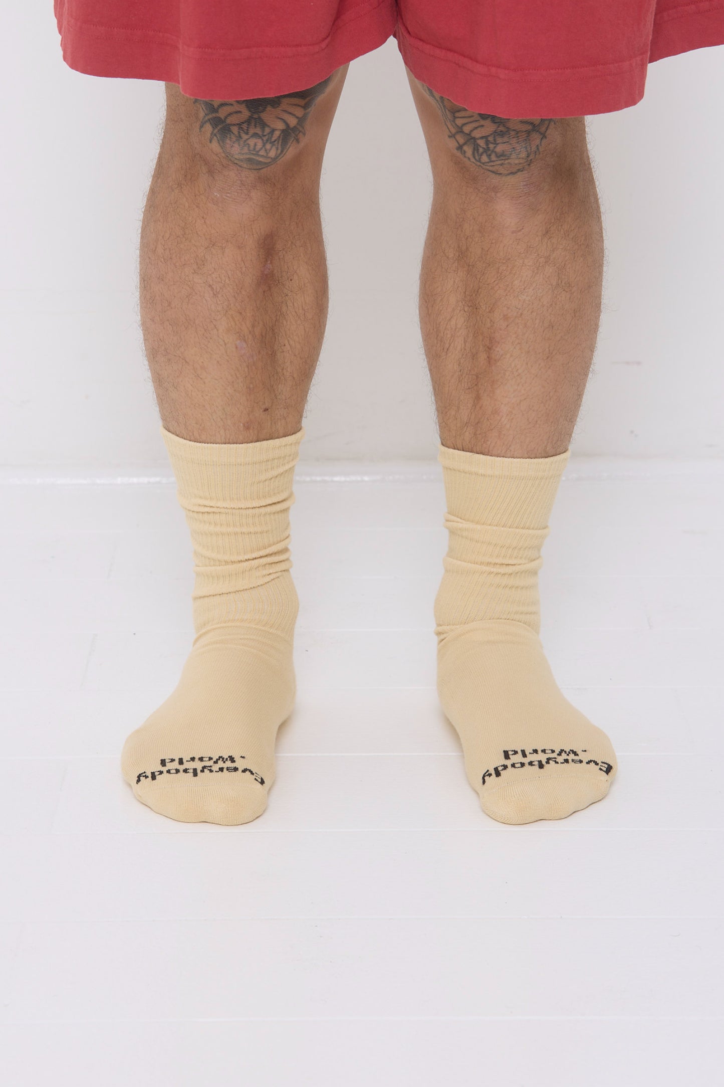 Turtle Dove Squishy Socks, branded 'Everybody.World' at the toe, are calf-high, shown on a person's lower legs.