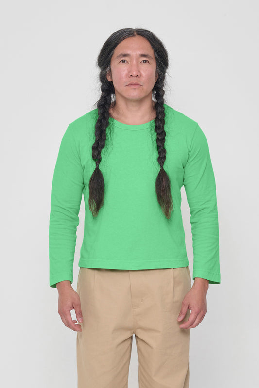 5'11" man in a size L Nice Grass Straight Sleeve Tailored Trash Tee. Hem at his hip.