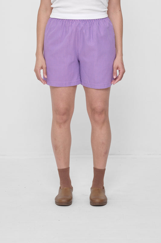 Size L Pixie Stripe Everyday Shorts on a 5'4" model. Hem hits their upper-mid thigh.