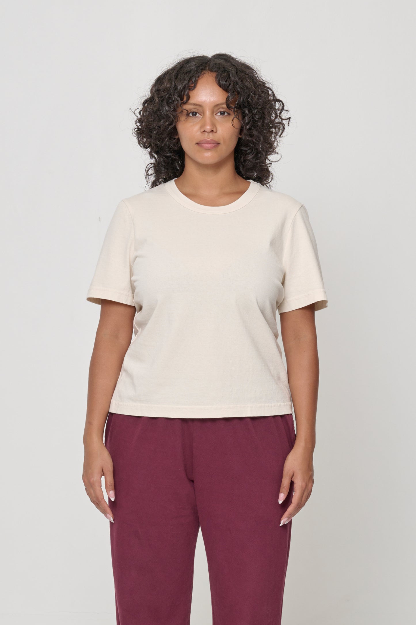 5'7" woman wearing a Scour Tailored Trash Tee in Size M, shirt hem hits her upper middle hip.