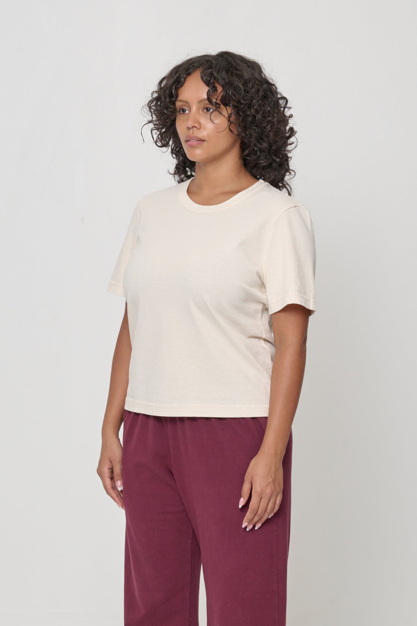 Tailored Trash Tee in Scour - 3/4 front view on person, showing side seams and slim short sleeves.