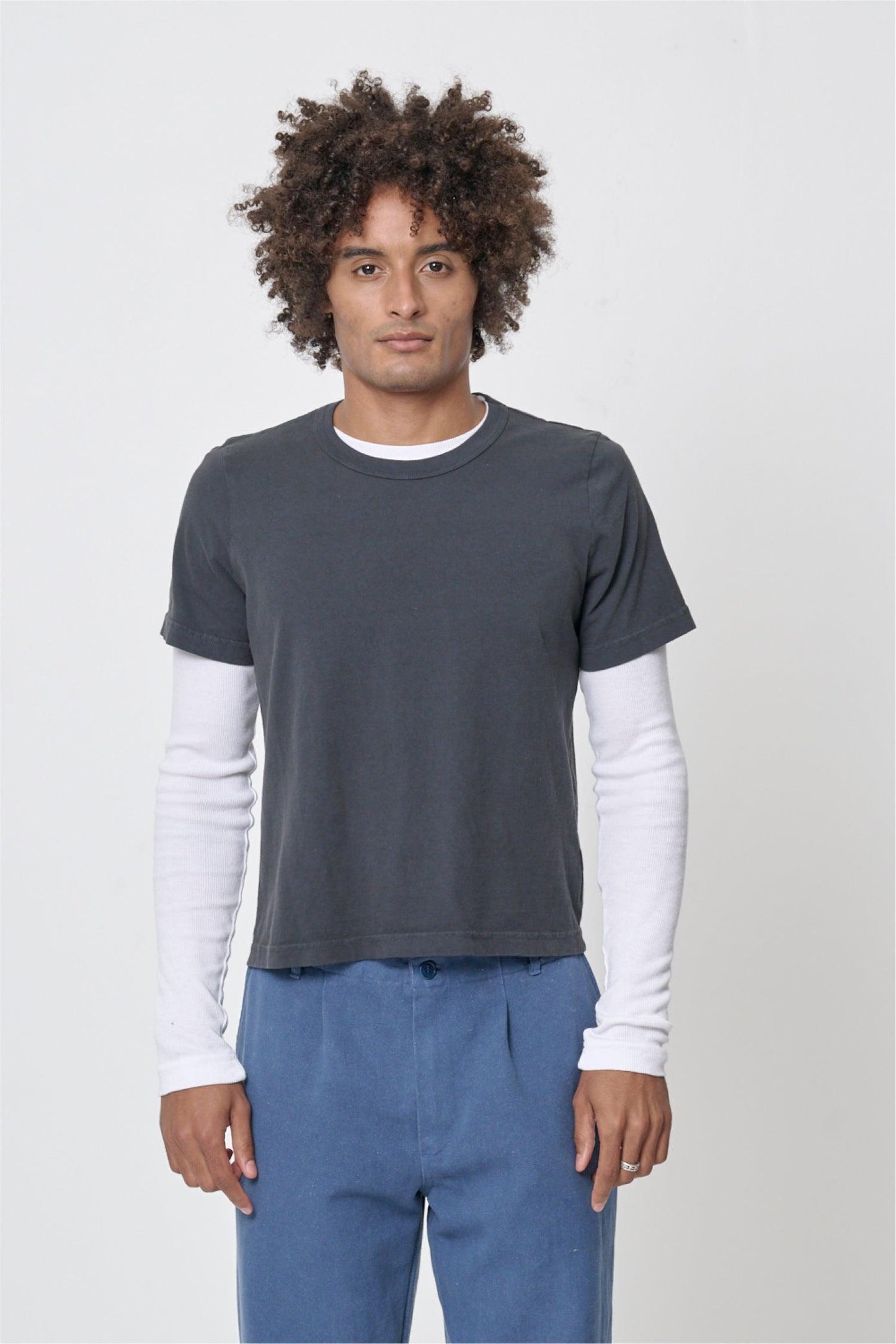 6' man wearing Slate Tailored Trash Tee in Size L, shirt hem hits his upper hip.