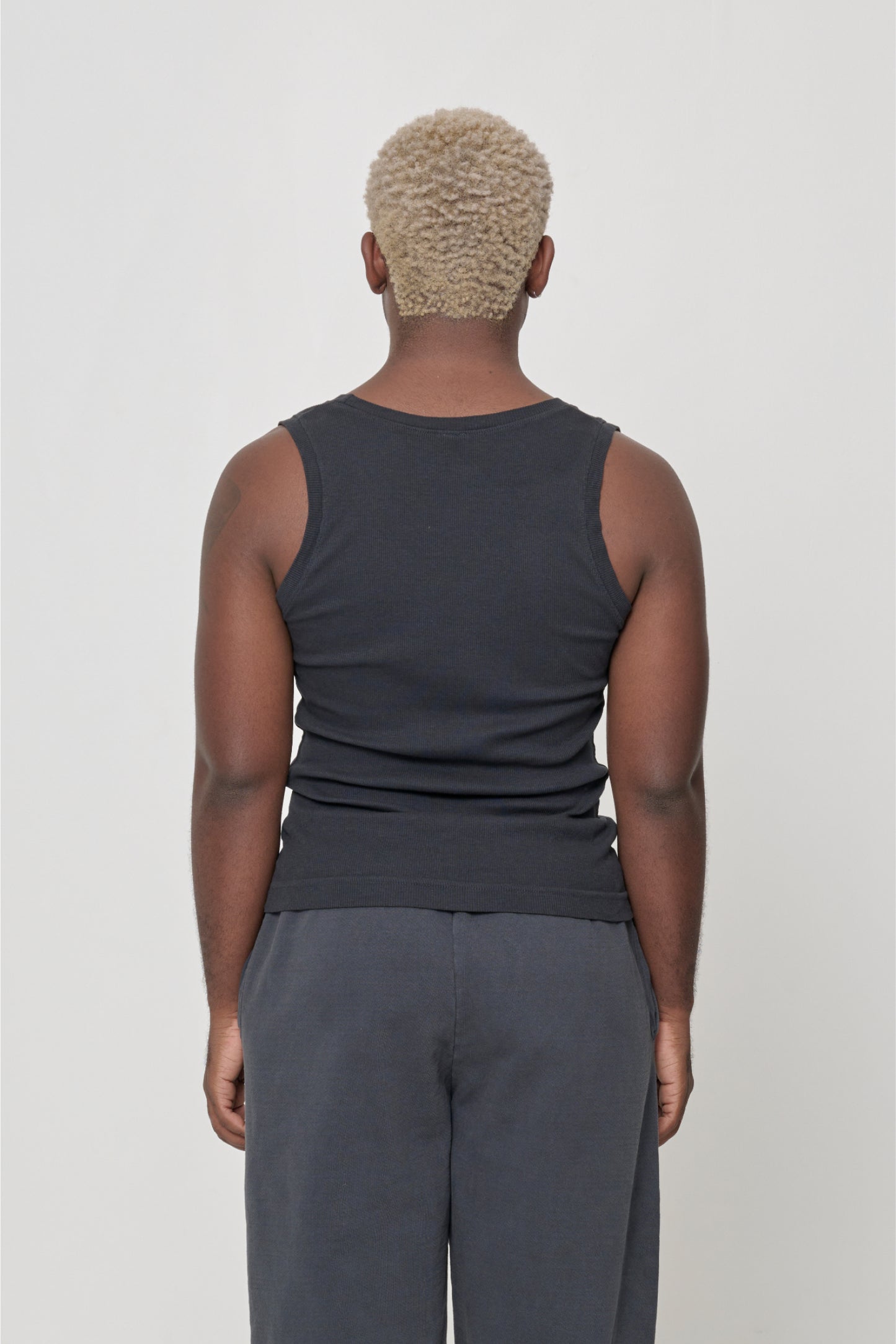 Back view: a person in a Slate The Tank, formfitting throughout.