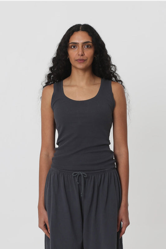 5'10" woman in a size S The Tank in Slate. Hem ends just above her hip bones.