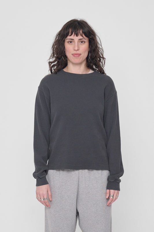 5'6" person in a size XS Slate Thermal Long Sleeve Boxier Trash Tee. Hem hits the upper hip.