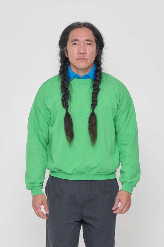5'11" man in a size M Nice Grass Trash Crewneck. Hem sits at his hip bones.