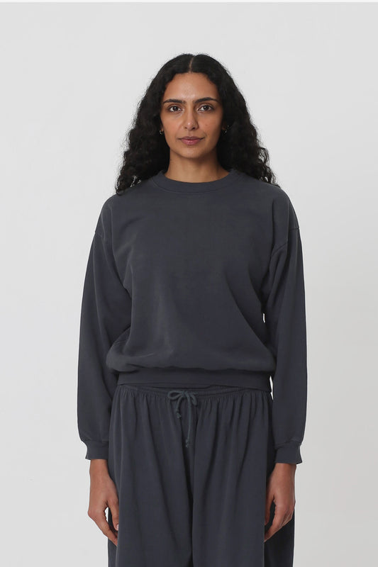 5'10" woman in a size XS Slate Trash Crewneck. Hem sits at her hip bones.