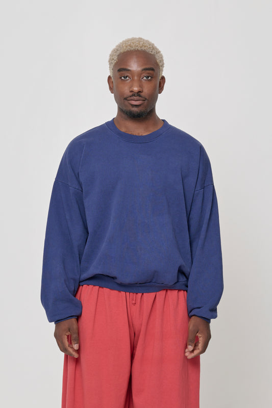 Front view: 5'9" man wearing Washed Navy Trash Crewneck in size L. Hem hits his upper middle hip.