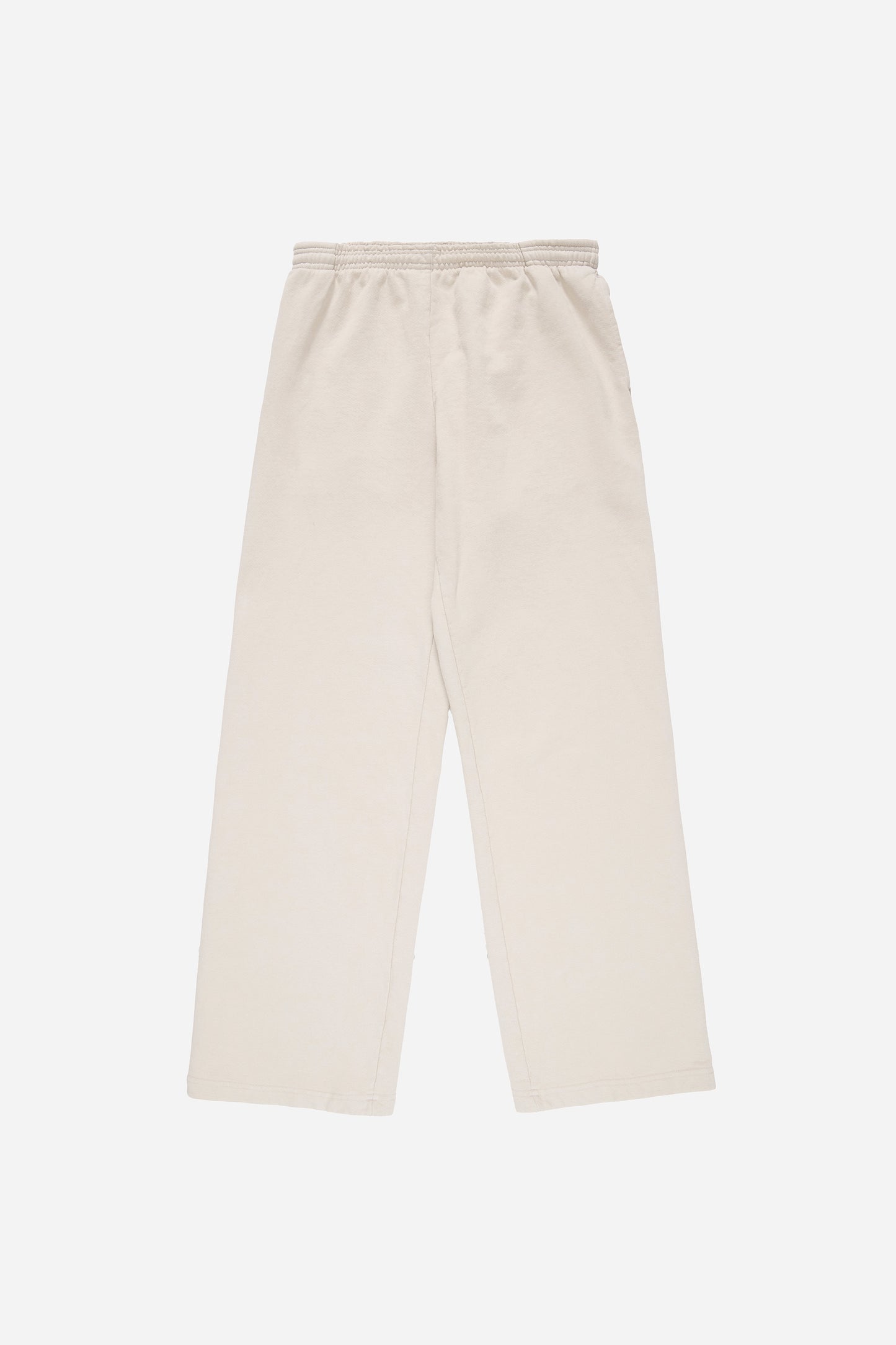 Flat lay of Trash Fleece Apartment Pants in Oat, showing the full length and straight leg of the relaxed-fit design.