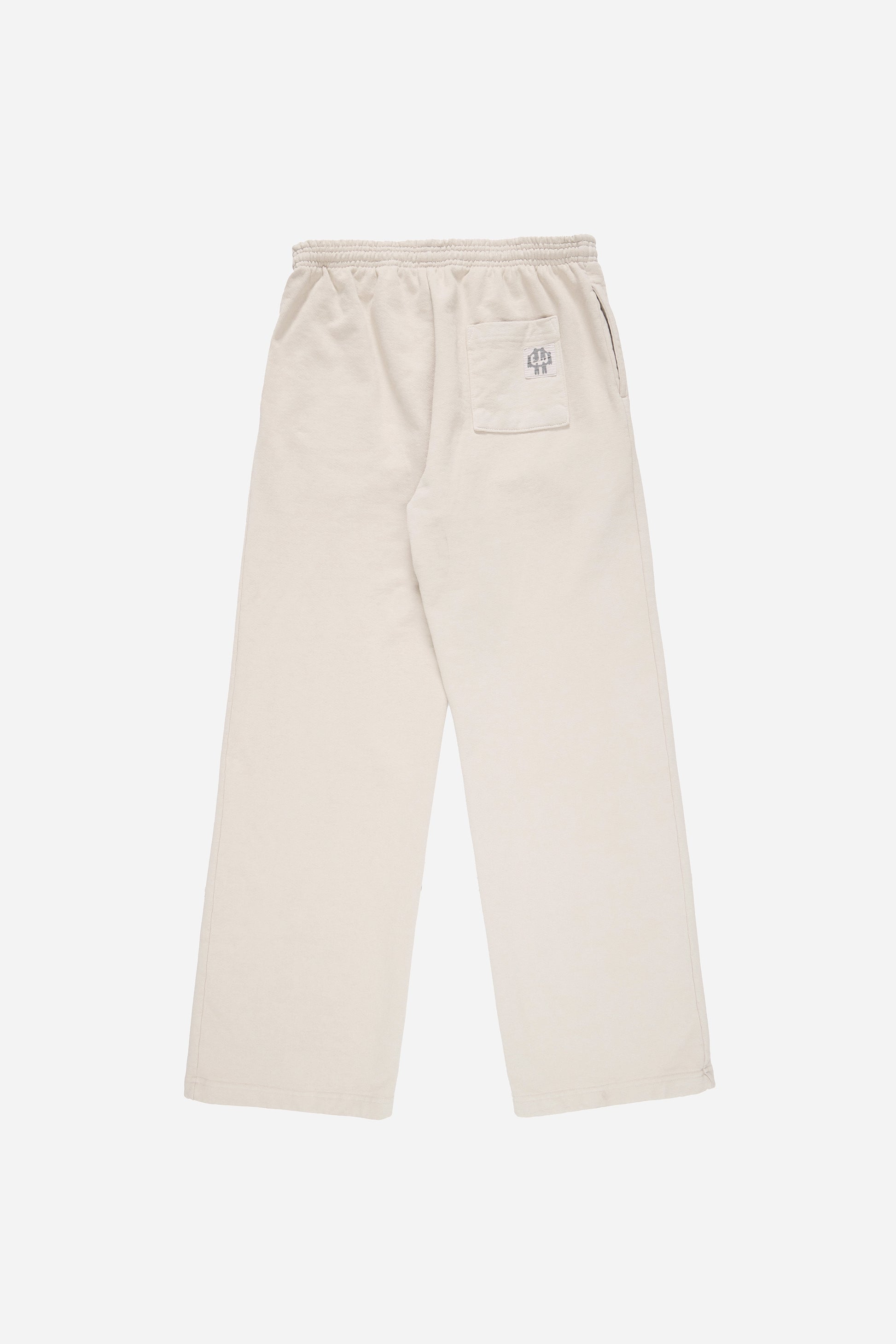 Flat lay of Trash Fleece Apartment Pants in Oat, showing the back of the leg and the pocket detail.