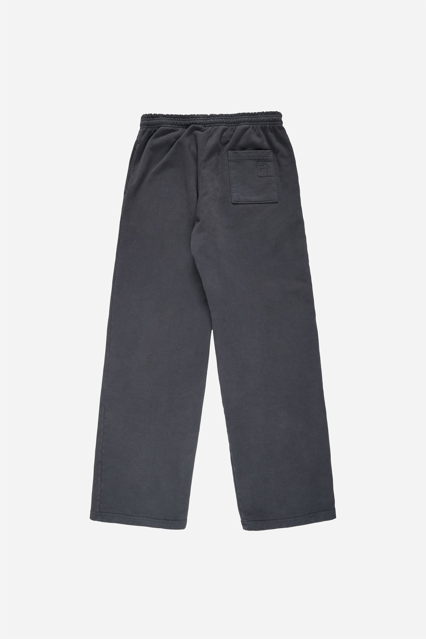 Flat lay of Trash Fleece Apartment Pants in Slate, showing the back of the leg and the pocket detail.