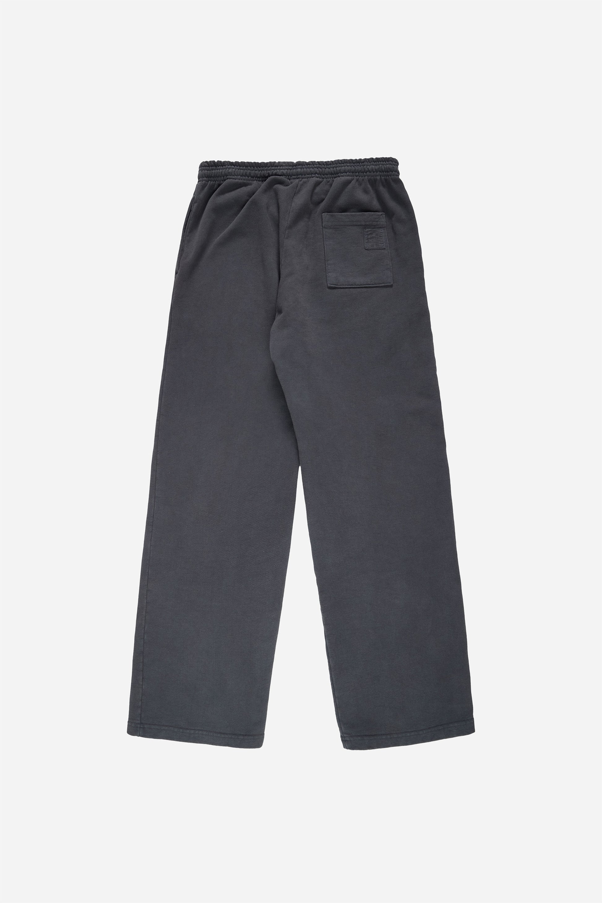 Flat lay of Trash Fleece Apartment Pants in Slate, showing the back of the leg and the pocket detail.