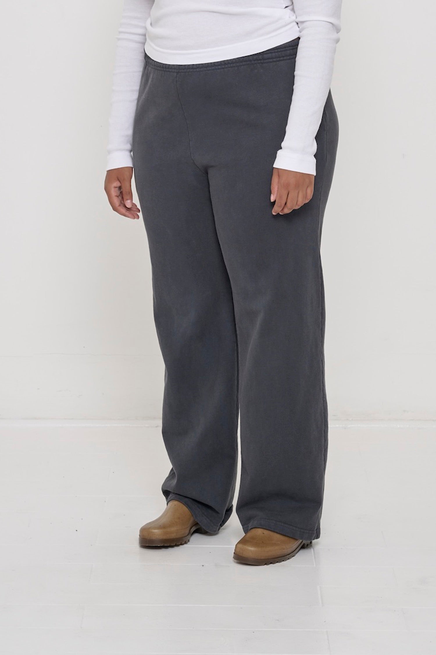 Person facing 45-degrees to the front in Slate Apartment Pants, showing inseam and outseam.