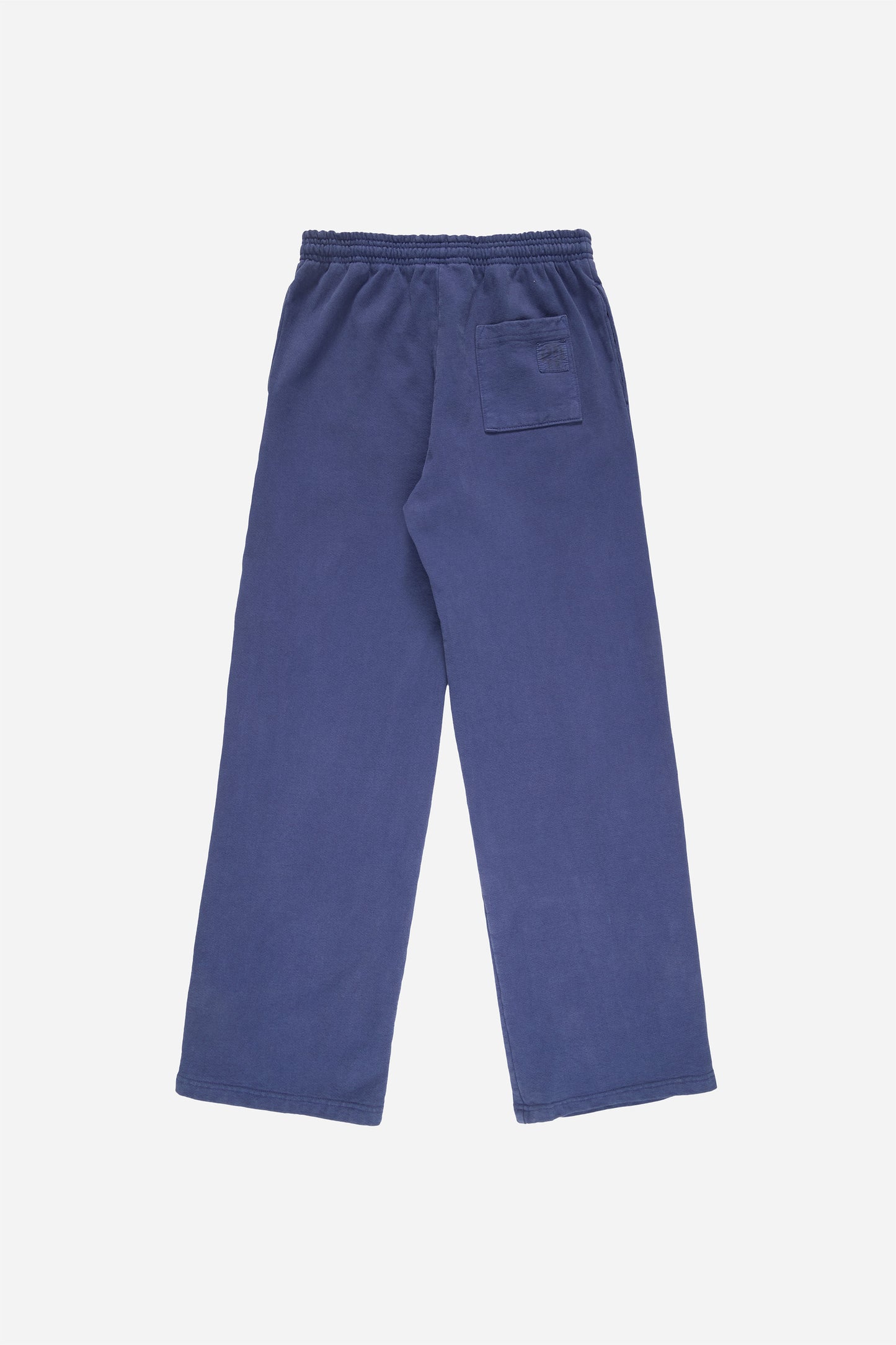 Flat lay of Trash Fleece Apartment Pants in Washed Navy, showing the back of the leg and the pocket detail.