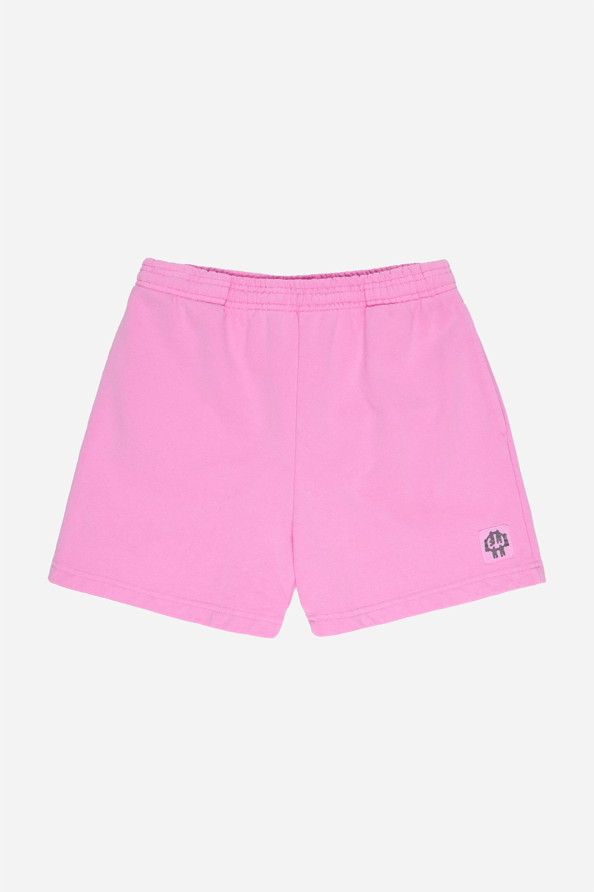 Flat lay of Pixie Trash Fleece Everyday Shorts shows elastic waist and E.W patch logo on bottom left shorts leg.