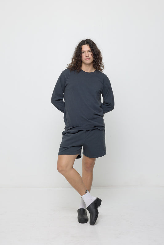 6' person in matching Slate Trash Crewneck and size L Trash Fleece Everyday Shorts. Shorts hem hit just upper-mid thigh.
