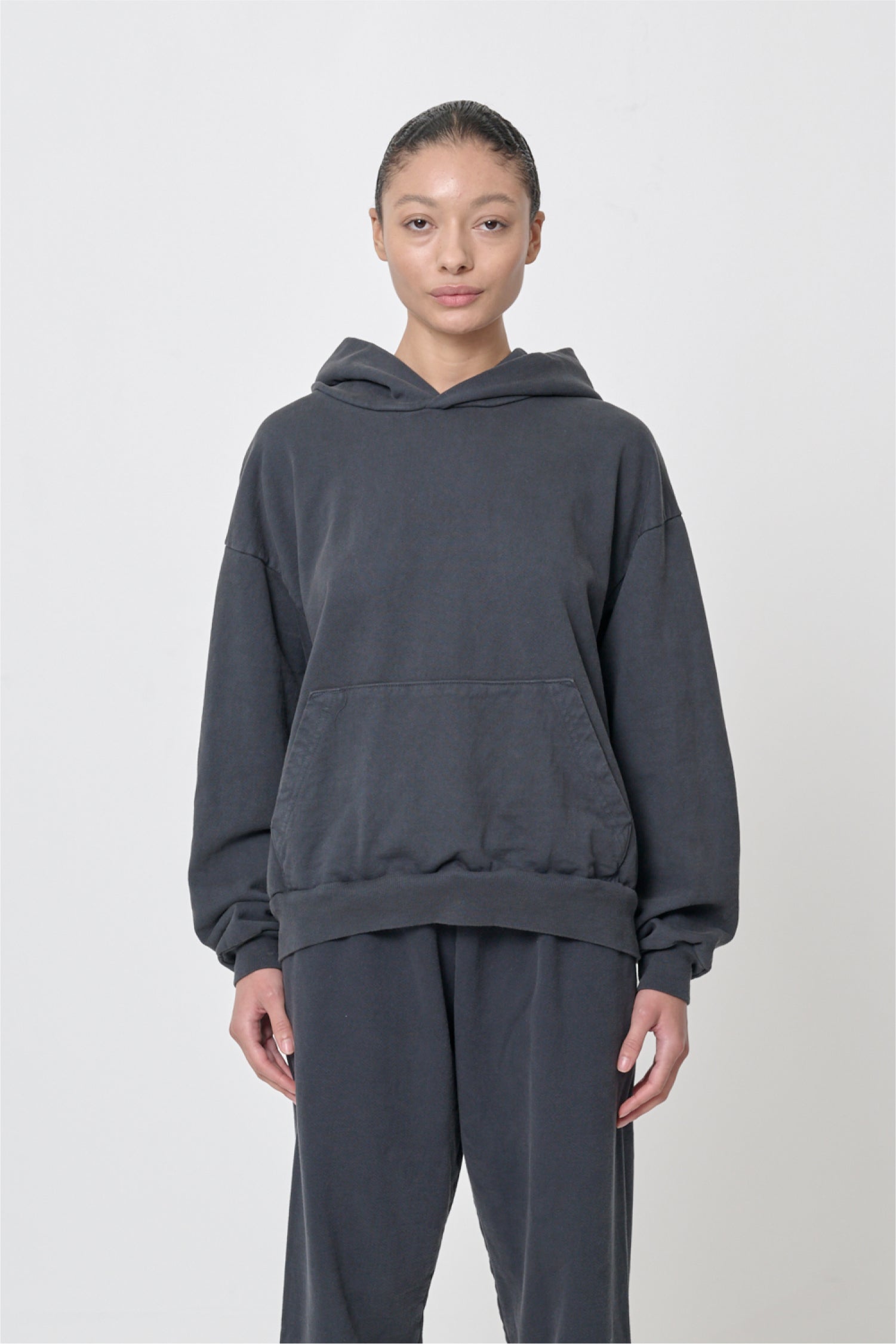 Front view: 5'8" woman wearing Slate Trash Hoodie in size S. Hem hits her lower hip.