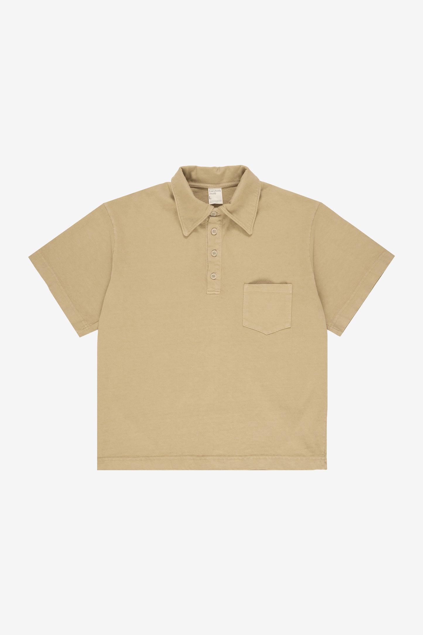 Flat lay showing the straight boxy cut of the body.