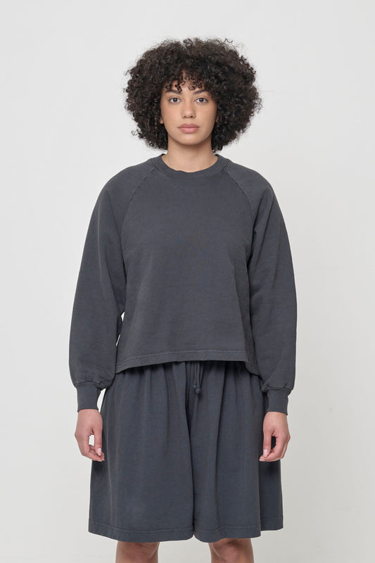 Front view: 5'8" woman wearing a Slate Trash Raglan in size XS. Hem hits her upper middle hip.