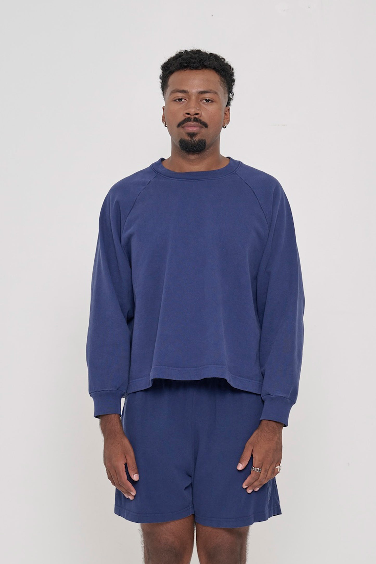 Front view: 6'2" man wearing a Washed Navy Trash Raglan. Hem hits his upper mid hip.