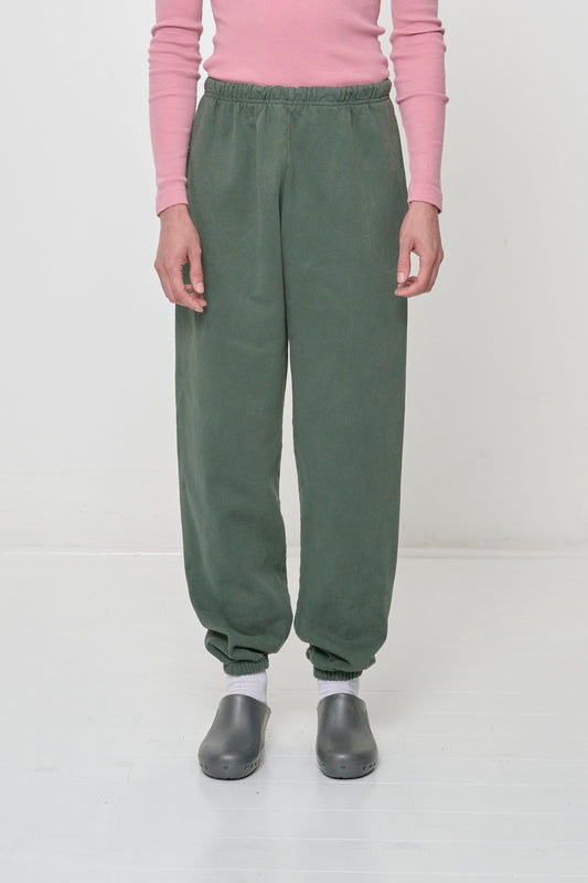 A 5'11" person in size M Pine Trash Sweatpants. Mild bunching at ankles.
