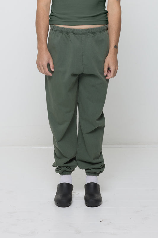 Front view: 6' person in size L Pine Trash Sweatpants, relaxed fit with slouchy bunching at knees and ankles.