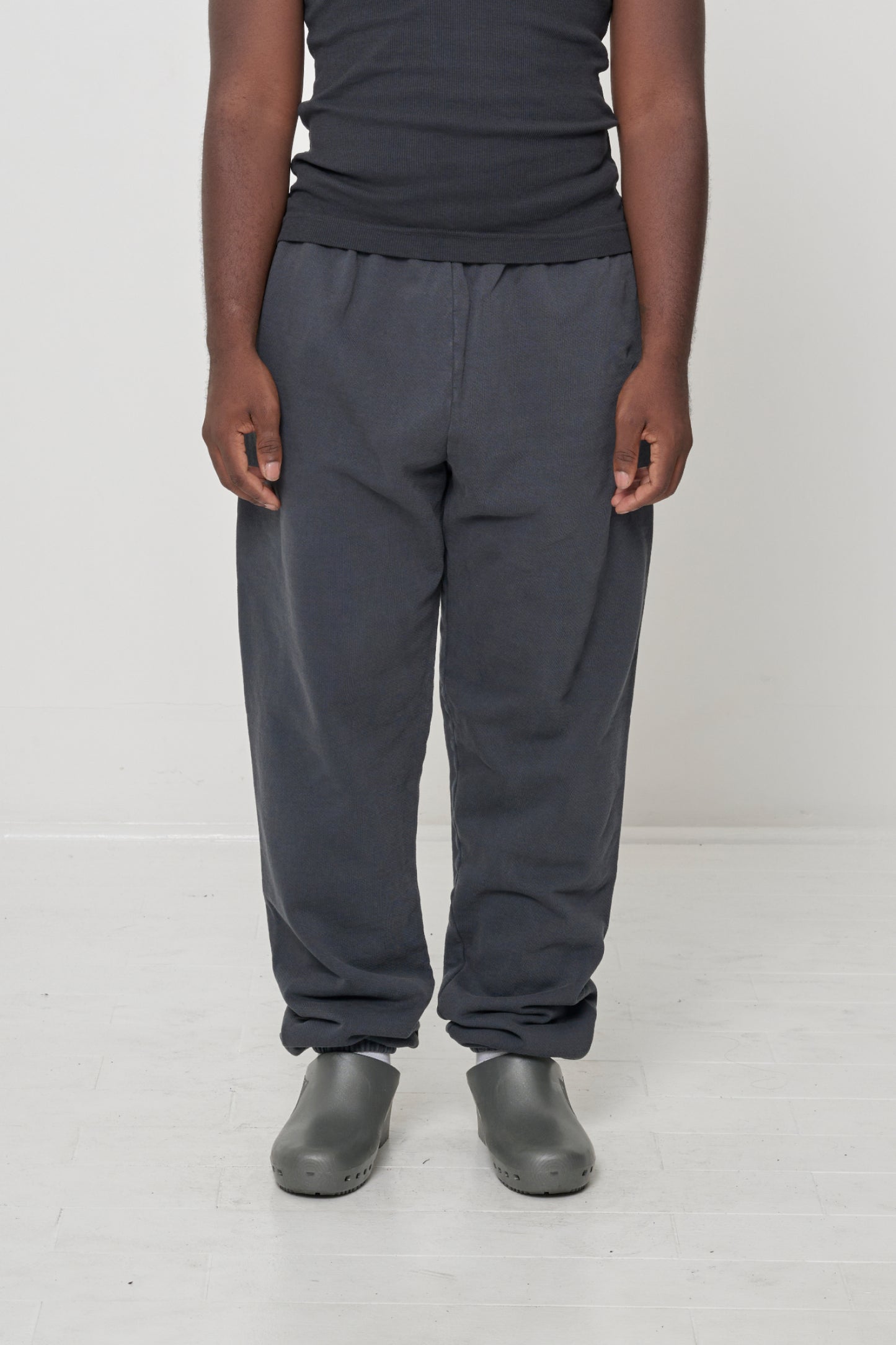 Front view: 5'9" person in size L Slate Trash Sweatpants, relaxed fit with slouchy bunching at knees and ankles.