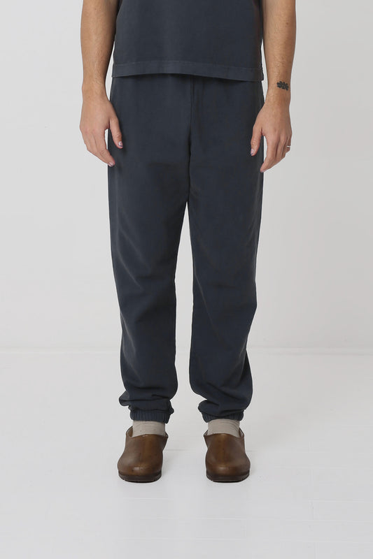A 6' person in size M Slate Trash Sweatpants. Slight bunching at the ankles.