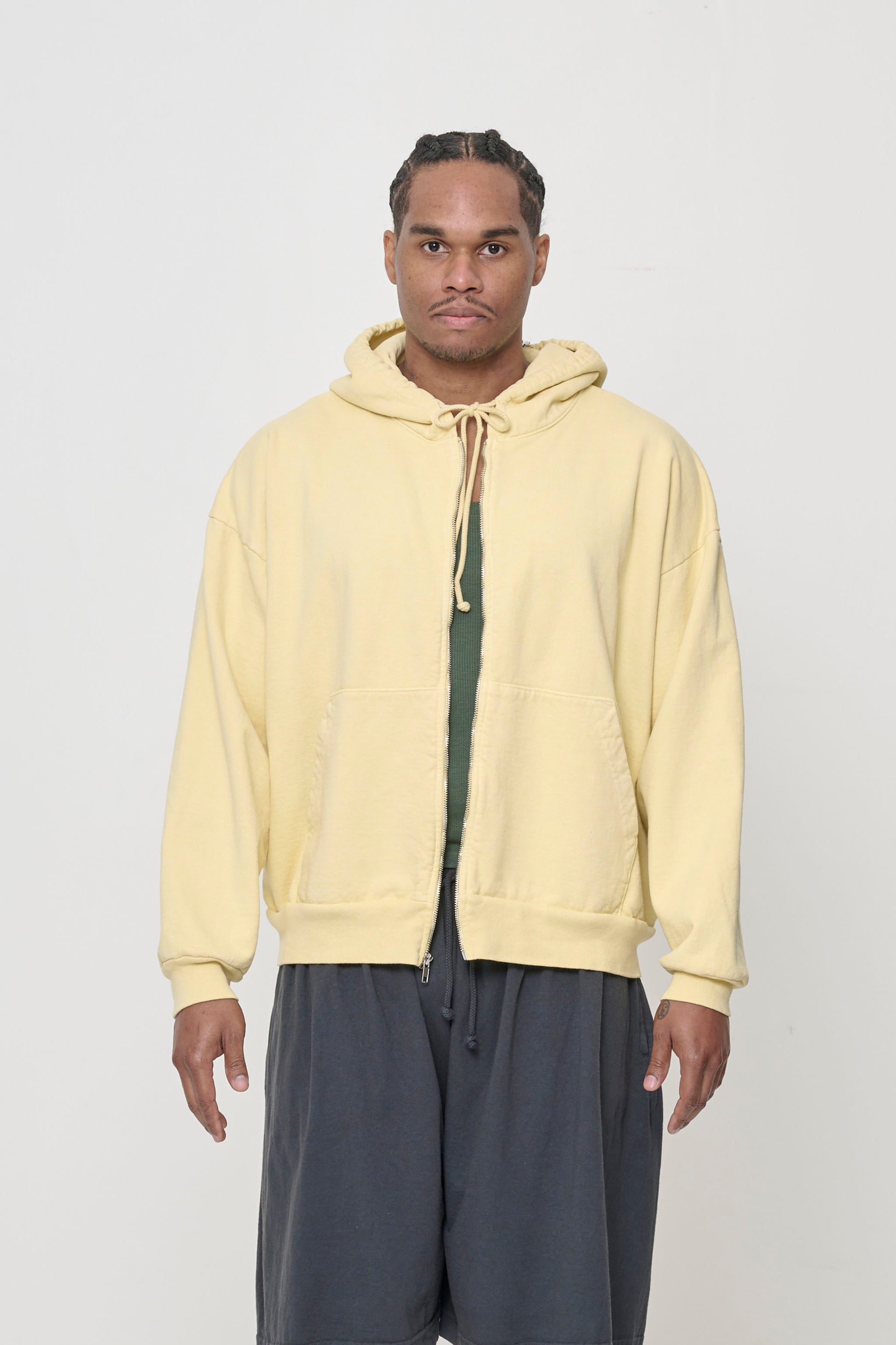 Front view: 6' person wearing French Butter Trash Zip Up Hoodie in size L. Hem hits mid hip.