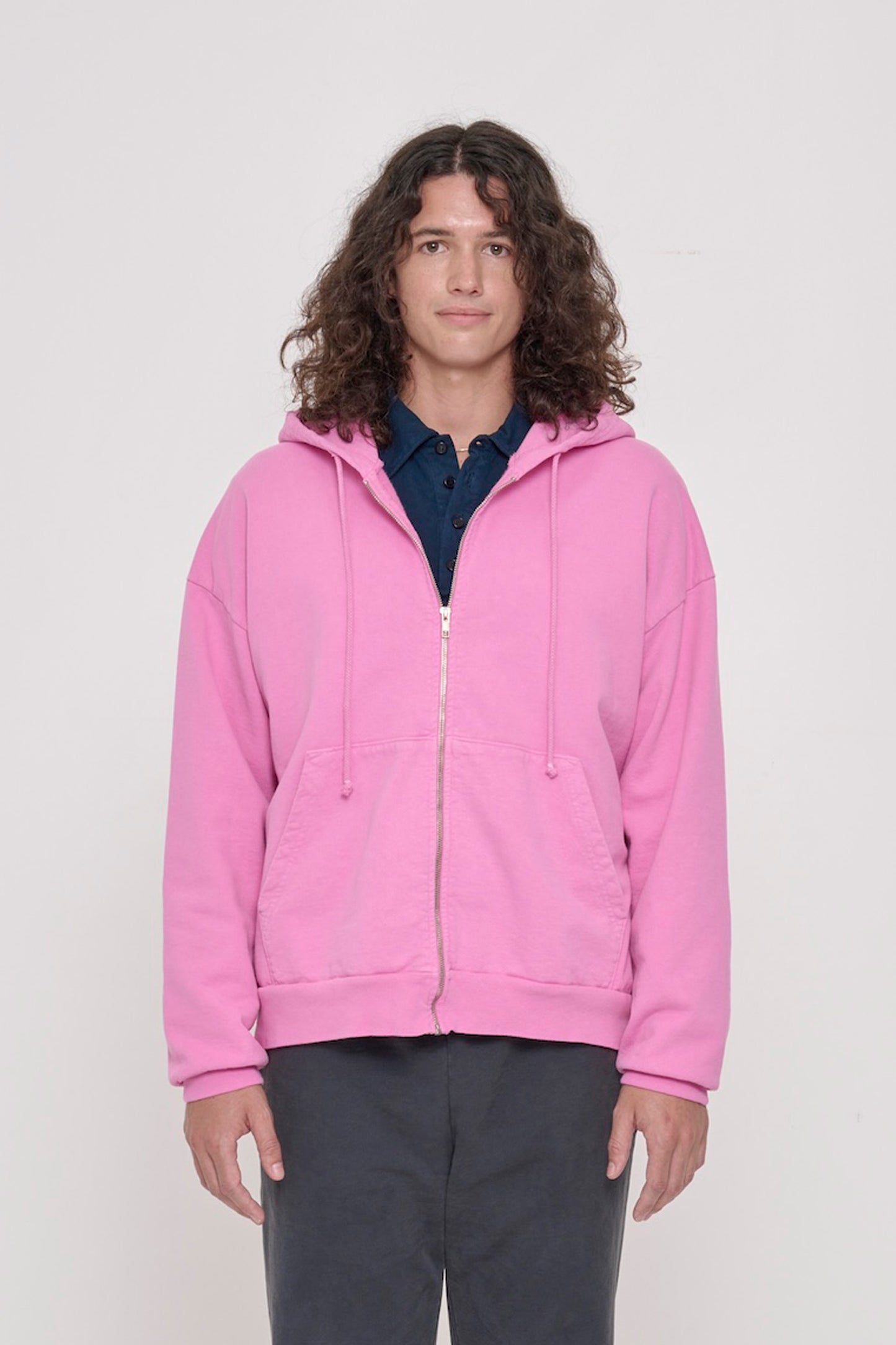 Front view of a person wearing Pixie Trash Zip Up Hoodie. Hem hits mid hip.