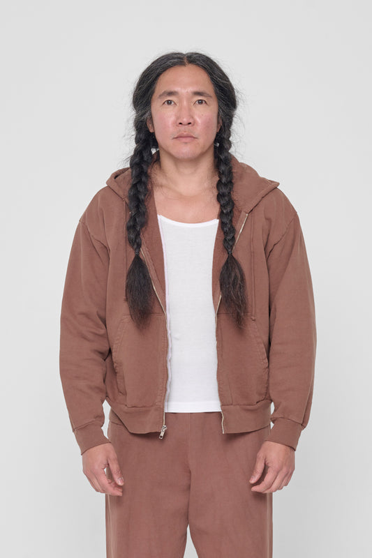 A 5'11" person wearing a size M Potting Soil Trash Zip Up Hoodie. Hem hits mid hip.