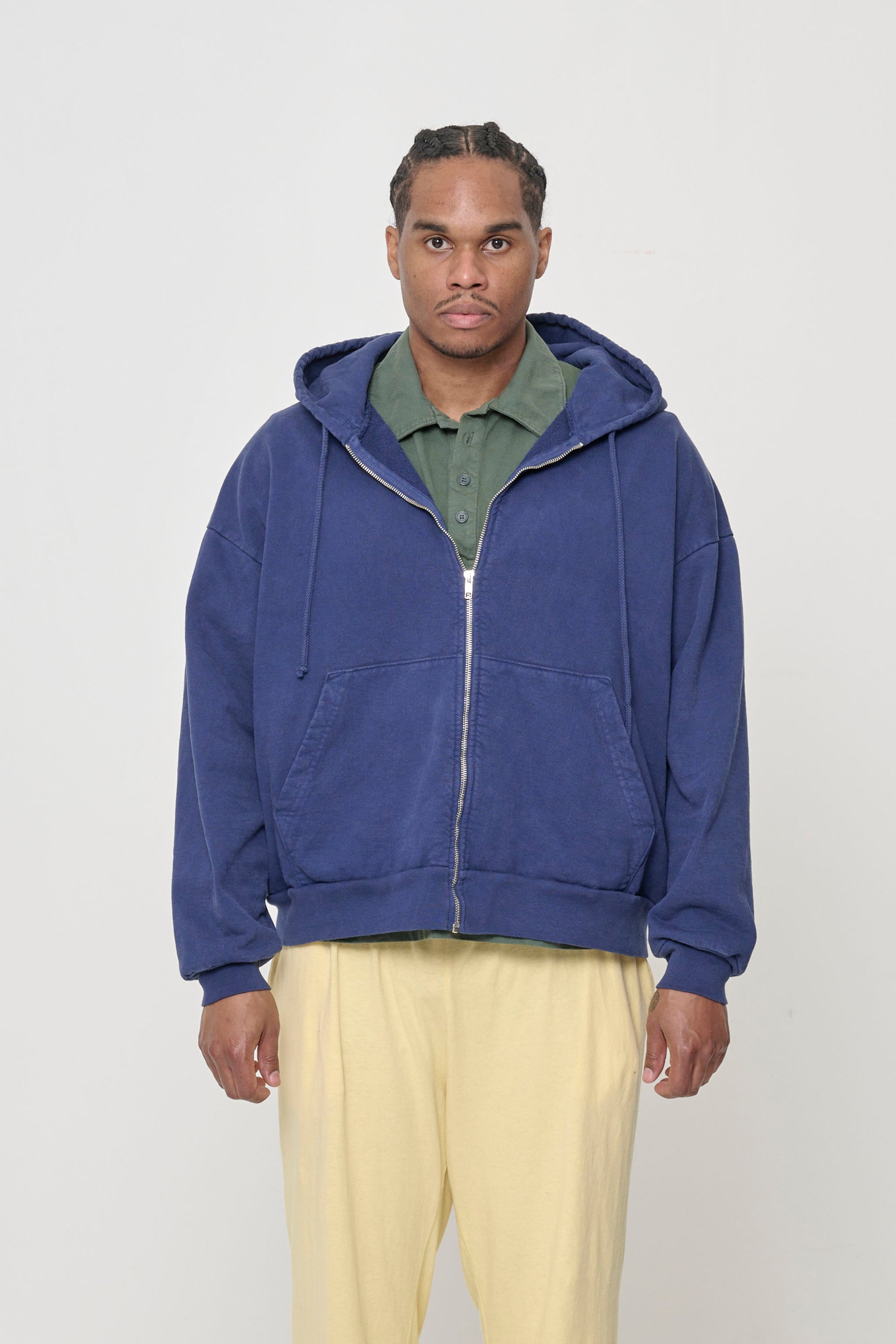 Front view: 6' man wearing Washed Navy Trash Zip Up Hoodie in size L. Hem hits mid hip.