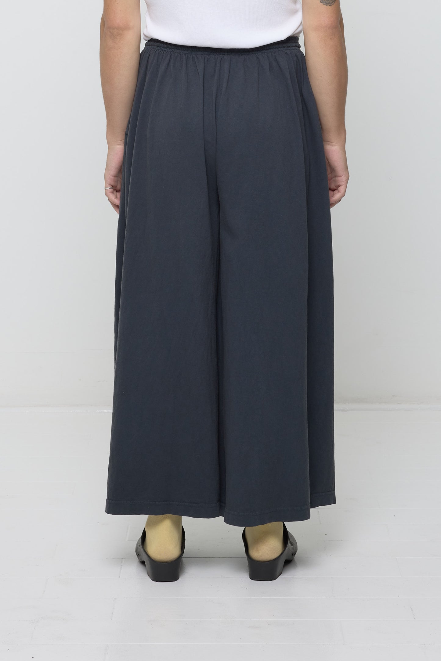 Back view: Lower 2/3 of a person wearing Slate Tubular Pants
