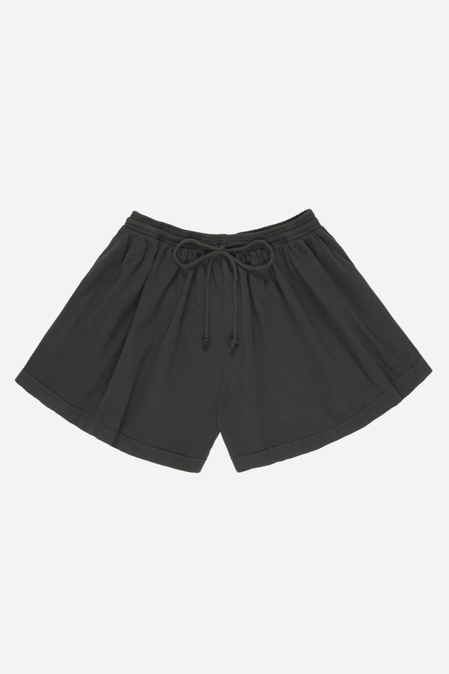 Flat lay of Slate Tubular Shorts shows tied waistband drawcord, wide leg openings and high-low hem.