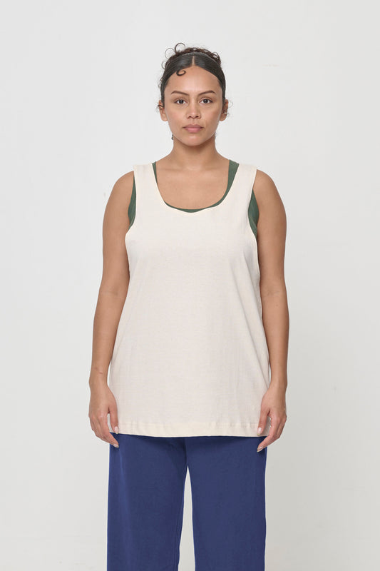 Front view of a 5'7" woman wearing a Tubular Tank in Scour. Hem hits just below her hips.