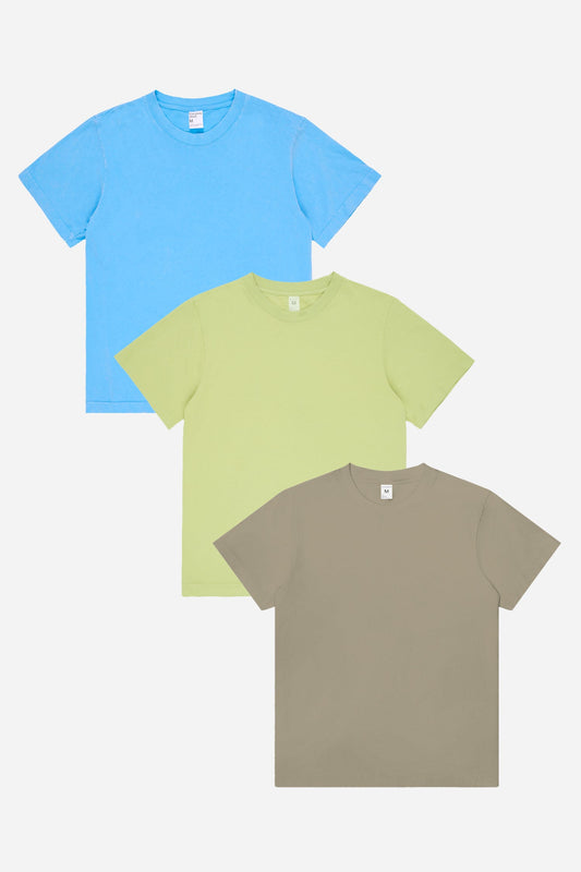 Flat lay of Azul blue and Cardamom light green tees