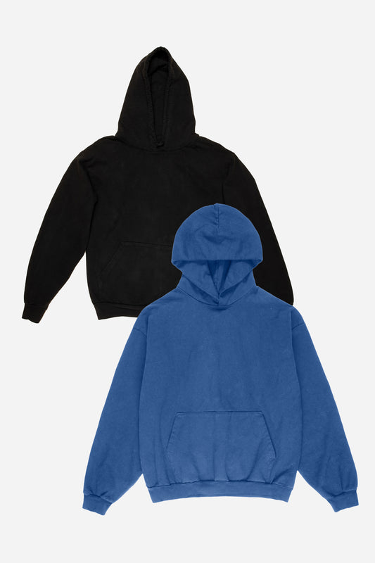 Flat lay of black and blue hoodies on a white background