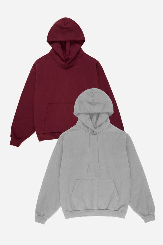 Flat lay of two hoodies, one Burgundy and one Grey, on a white background