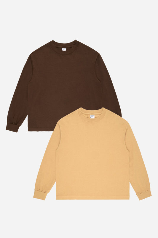 Flat lay of Amber and Soil tees