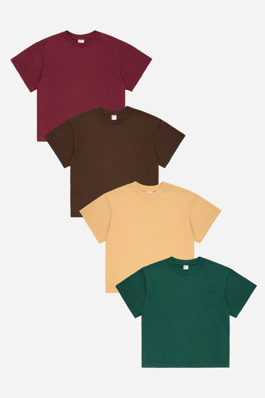 Flat lay of Amber, Soil and Moss green boxy short sleeve tees