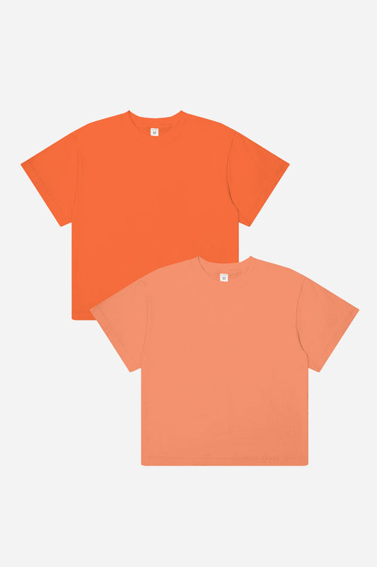 A peach and orange t-shirt on a white background