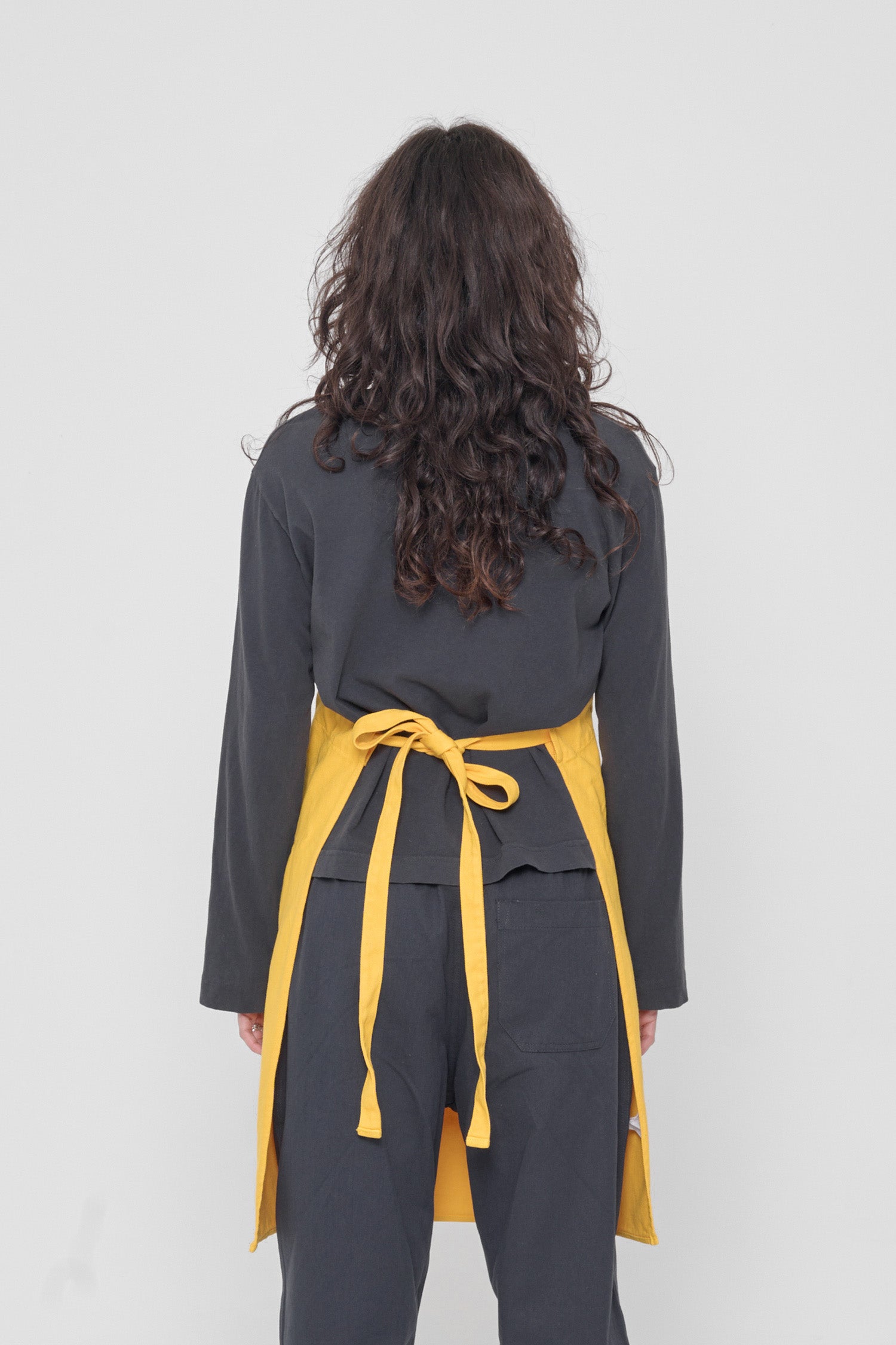 Rear view shows the waist straps tied.