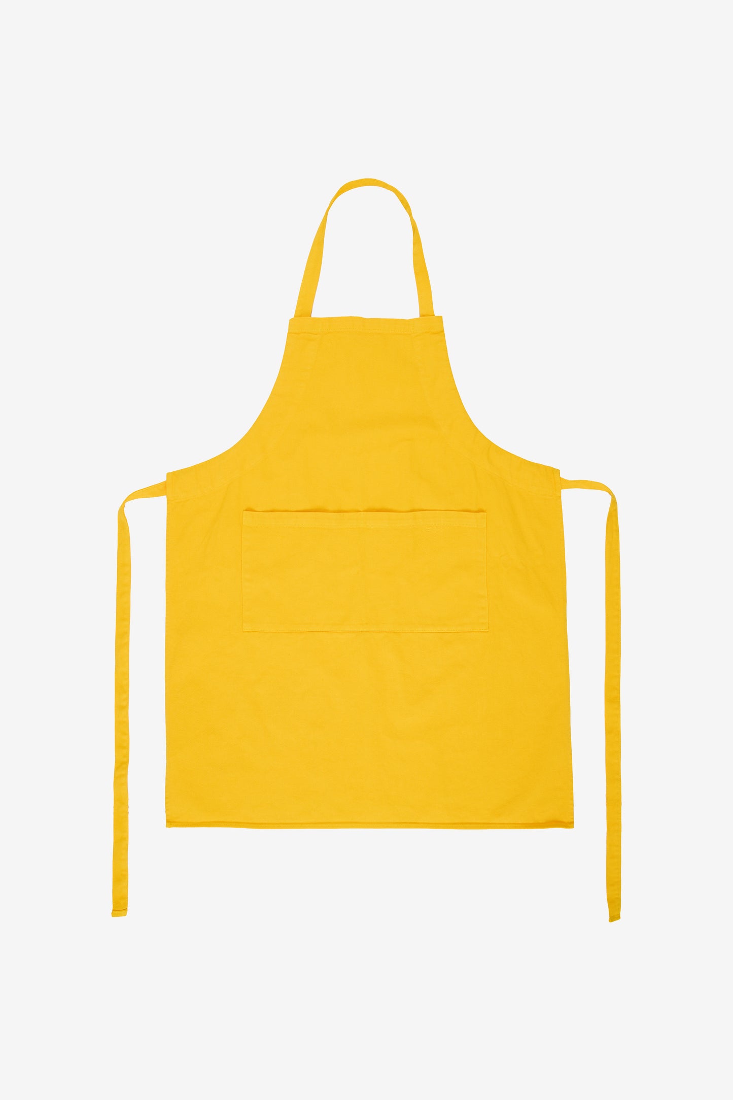 Flat lay with straps untied and to the sides of the apron.